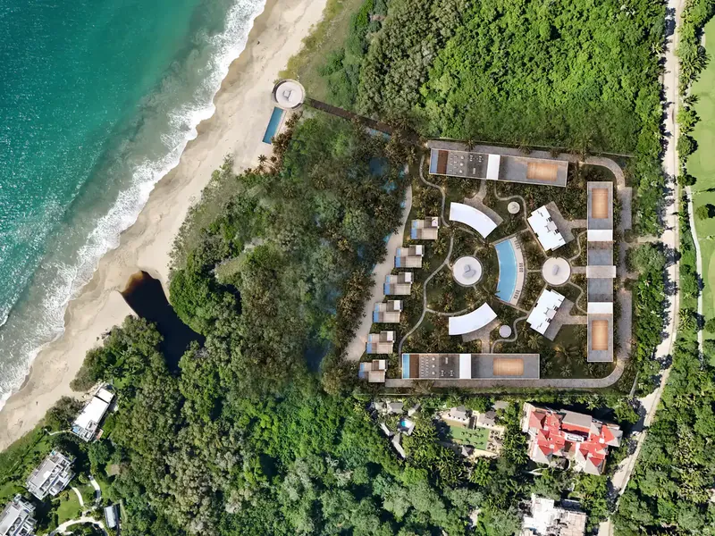 Aerial view of a beachfront development among mangroves in Litibú